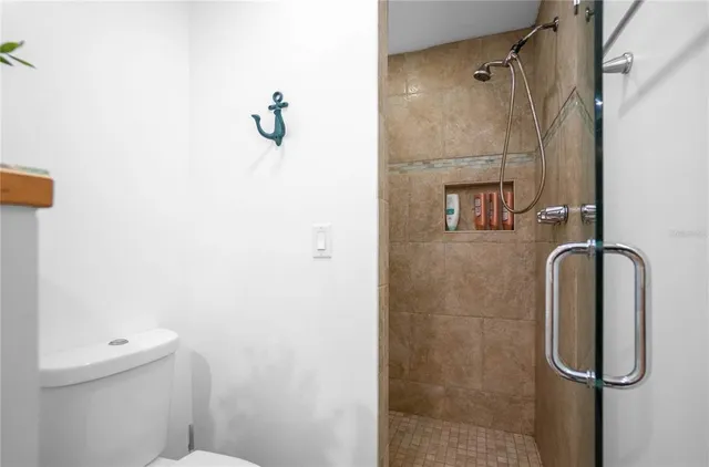 a view of a lush green forest with lots of trees