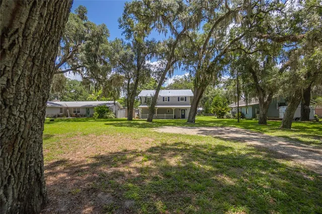 a view of an entryway with wooden floor and stairs
