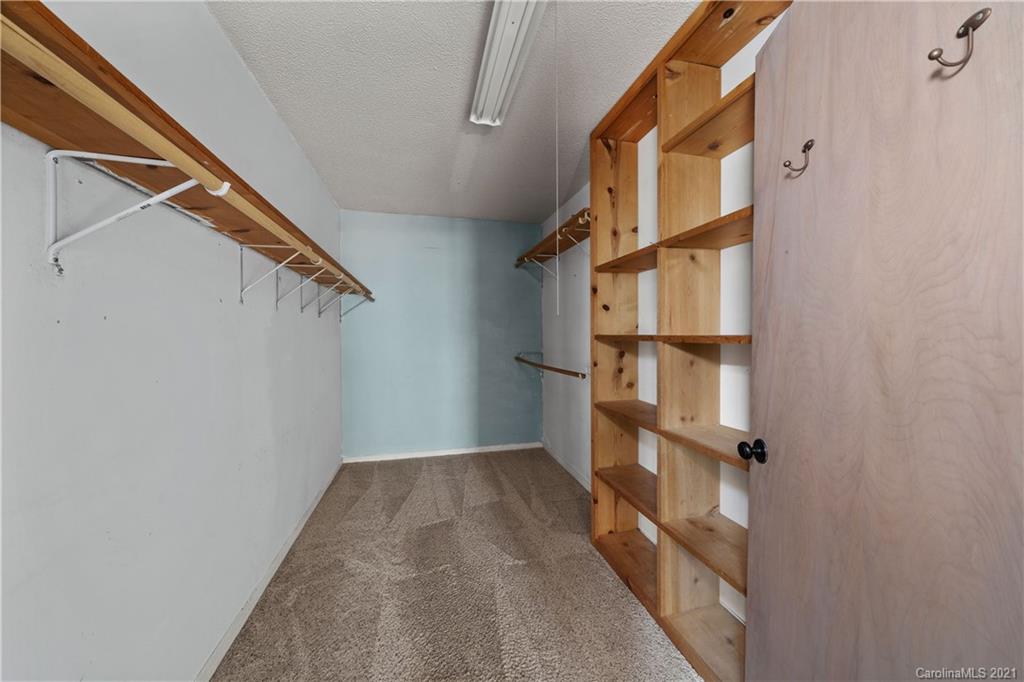 153 Miller Drive Tryon, NC 28782 - Photo 17 of 28 a view of staircase with wooden floor and lots of windows