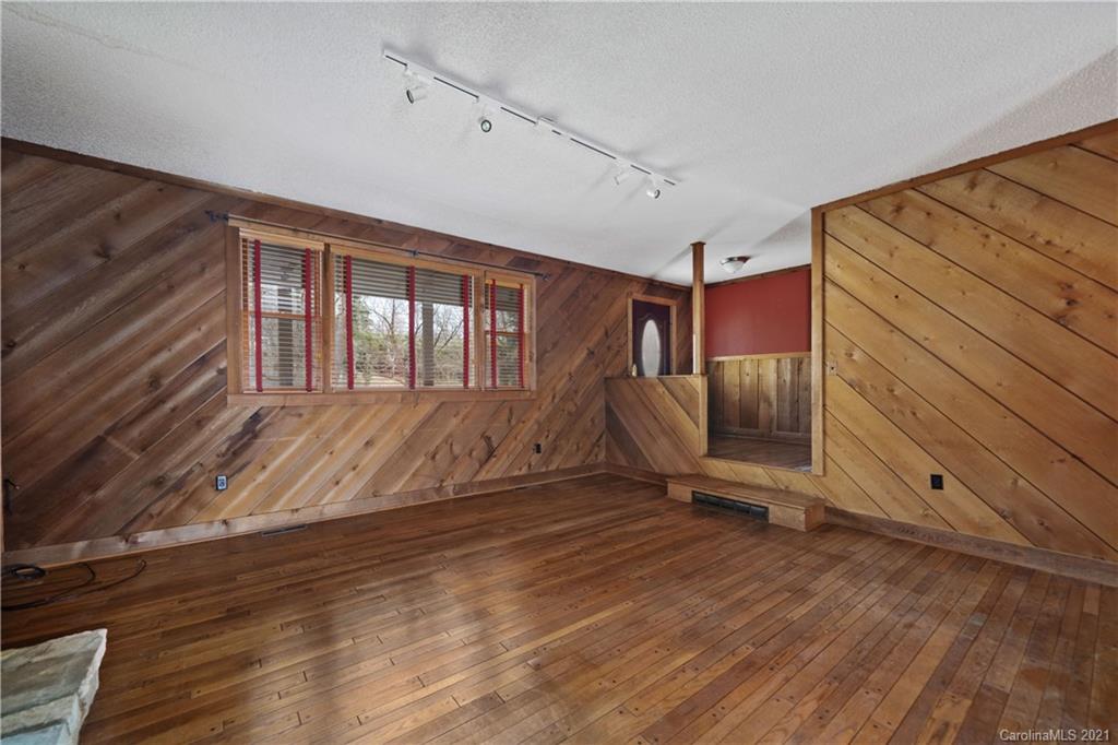 153 Miller Drive Tryon, NC 28782 - Photo 7 of 28 a view of an empty room with wooden floor