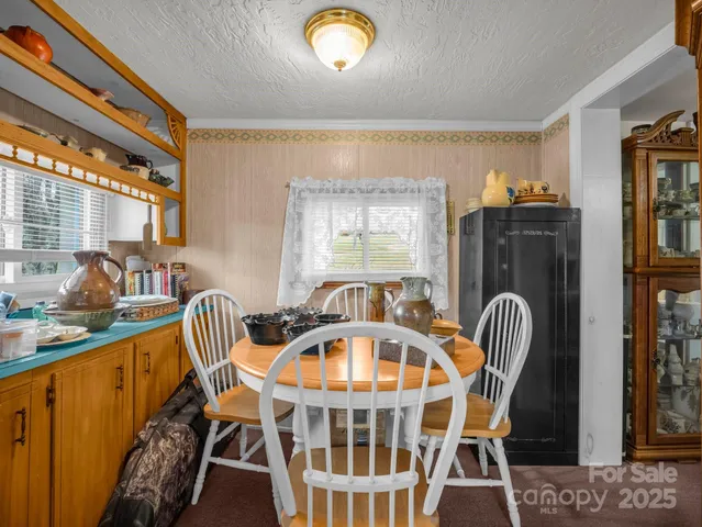 a view of a livingroom with furniture window and staircase