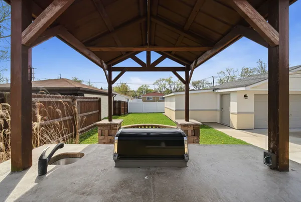 a car parked in front of a house with a yard