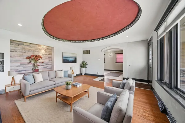 a living room with furniture and a fireplace