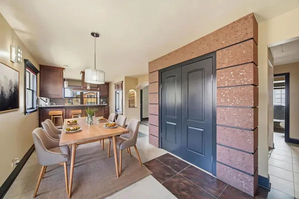 a dining room with furniture and window