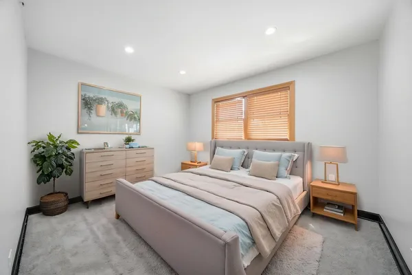 a bed room with a bed and a couch