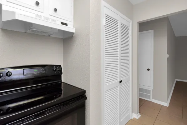 a spacious bathroom with a granite countertop sink and a mirror