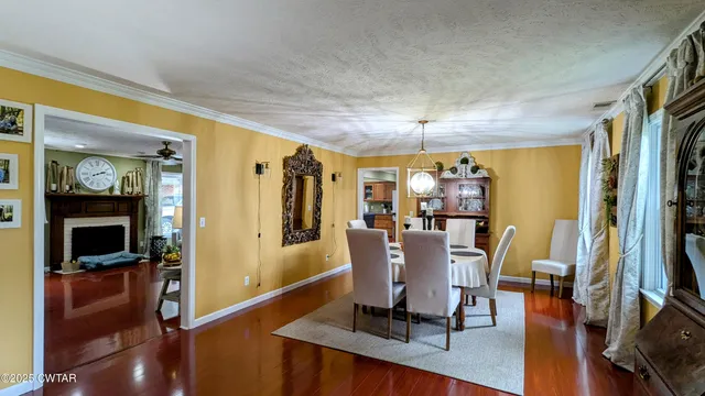 a bedroom with a bed lamps and a large mirror on the dresser