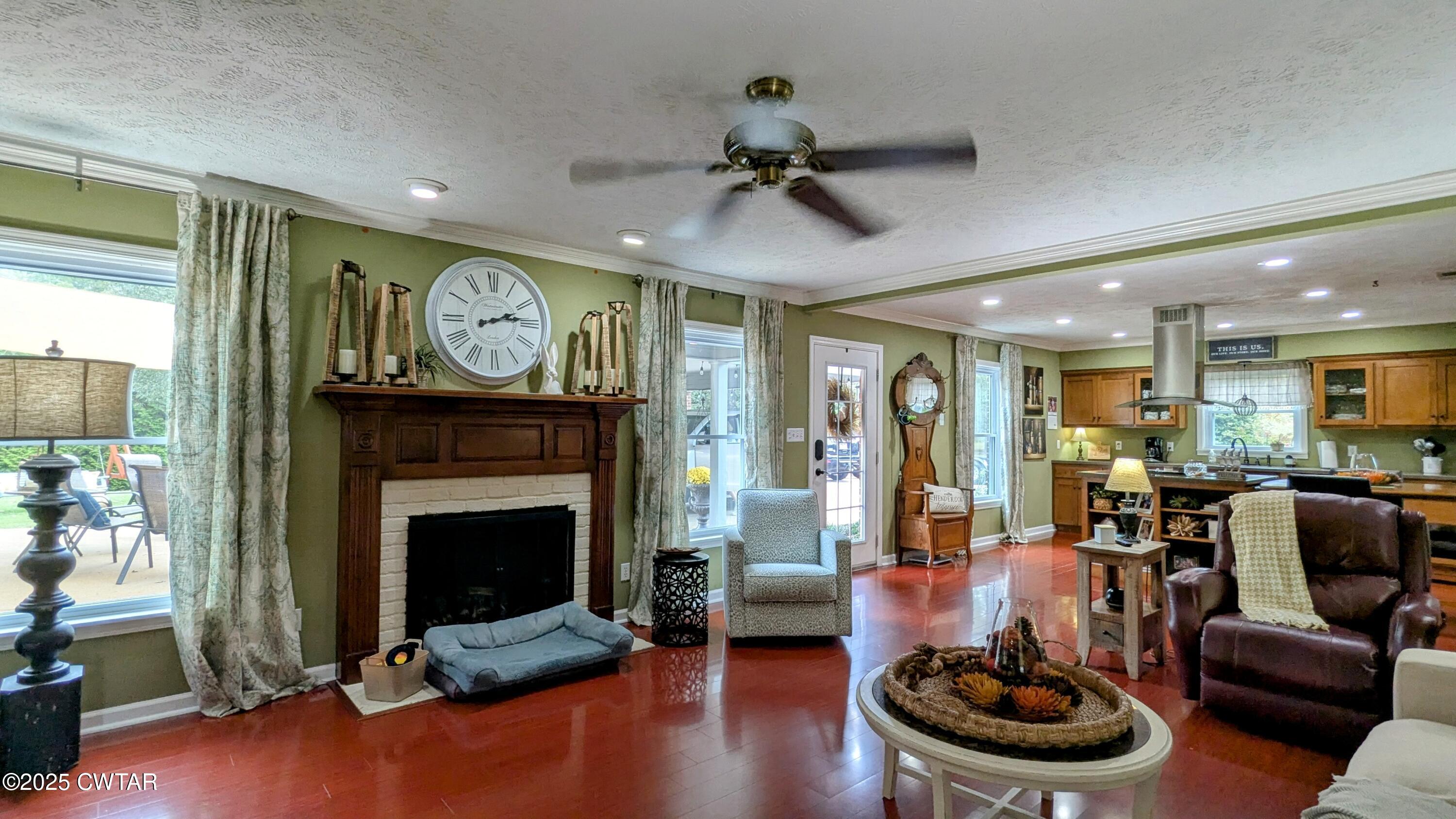 614 Oneal Lane Henderson, TN 38340 - Photo 28 of 69 a living room with furniture and a fireplace