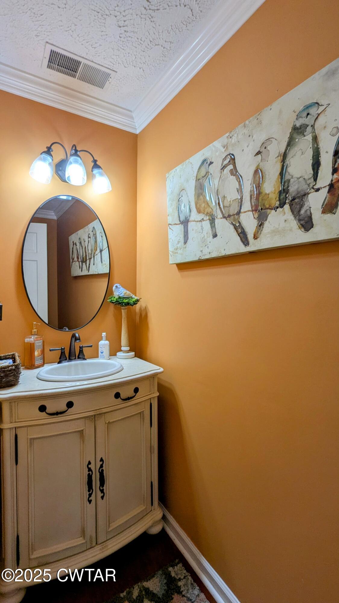 614 Oneal Lane Henderson, TN 38340 - Photo 30 of 69 a bathroom with a sink and a mirror