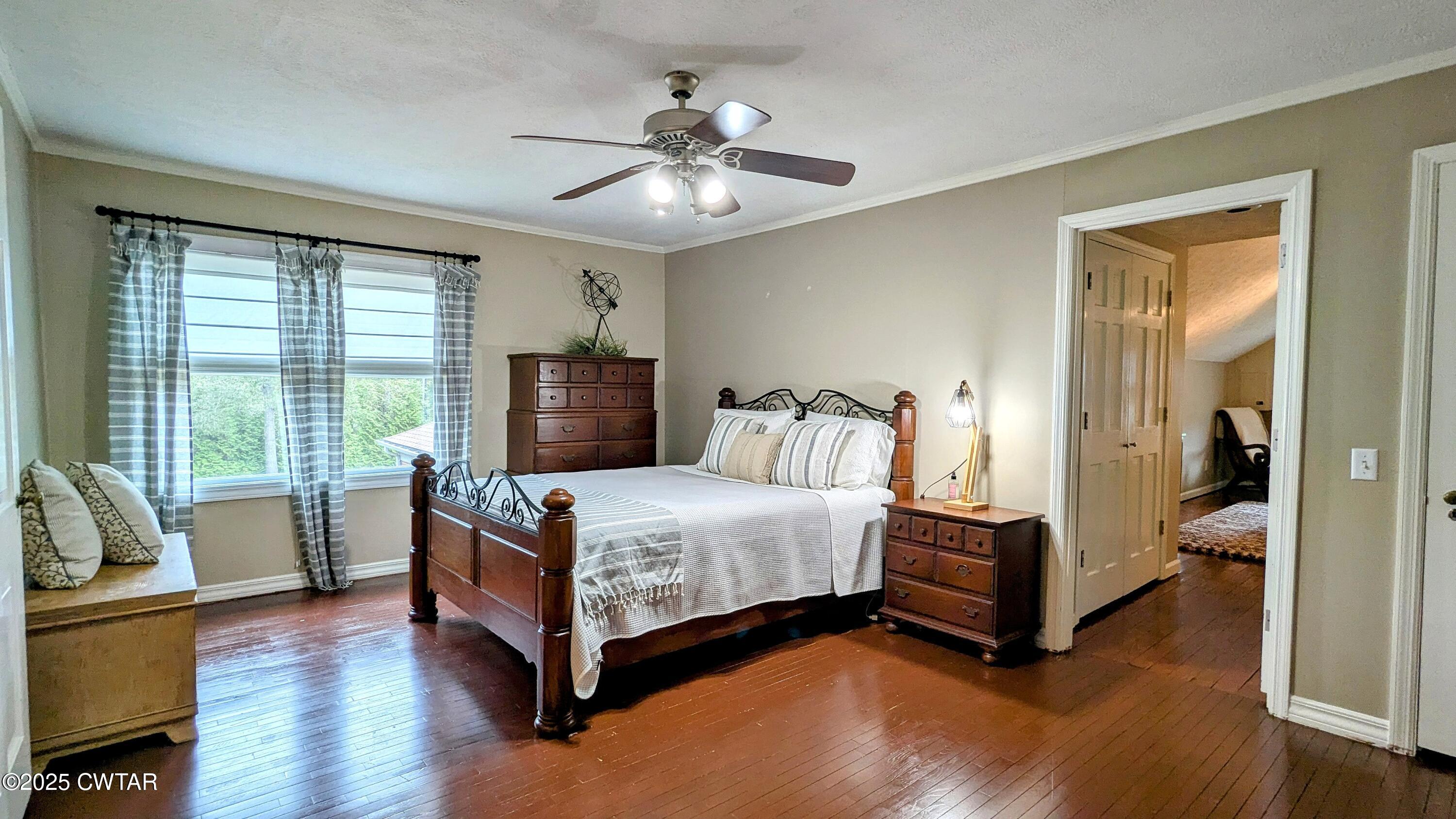 614 Oneal Lane Henderson, TN 38340 - Photo 53 of 69 a bedroom with a bed and wooden floor