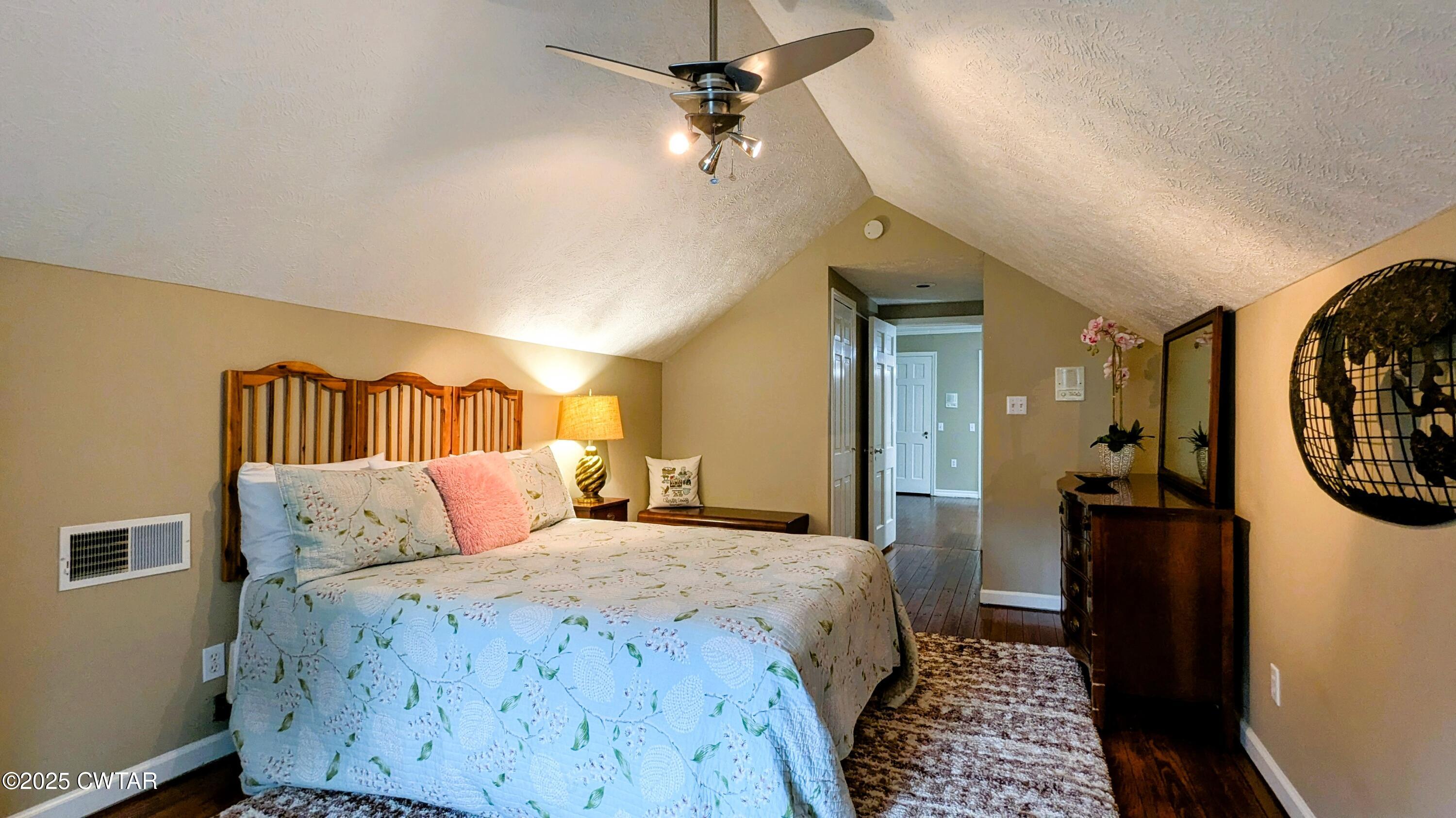 614 Oneal Lane Henderson, TN 38340 - Photo 56 of 69 a bedroom with a bed and a chandelier