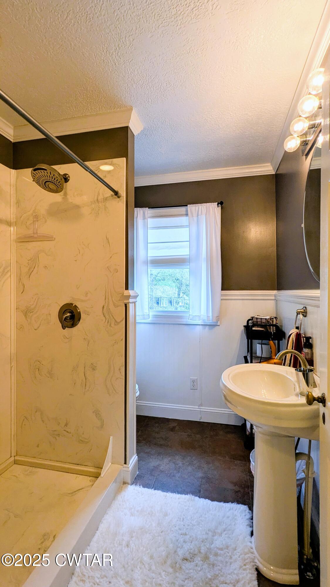 614 Oneal Lane Henderson, TN 38340 - Photo 57 of 69 a bathroom with a sink a mirror and shower