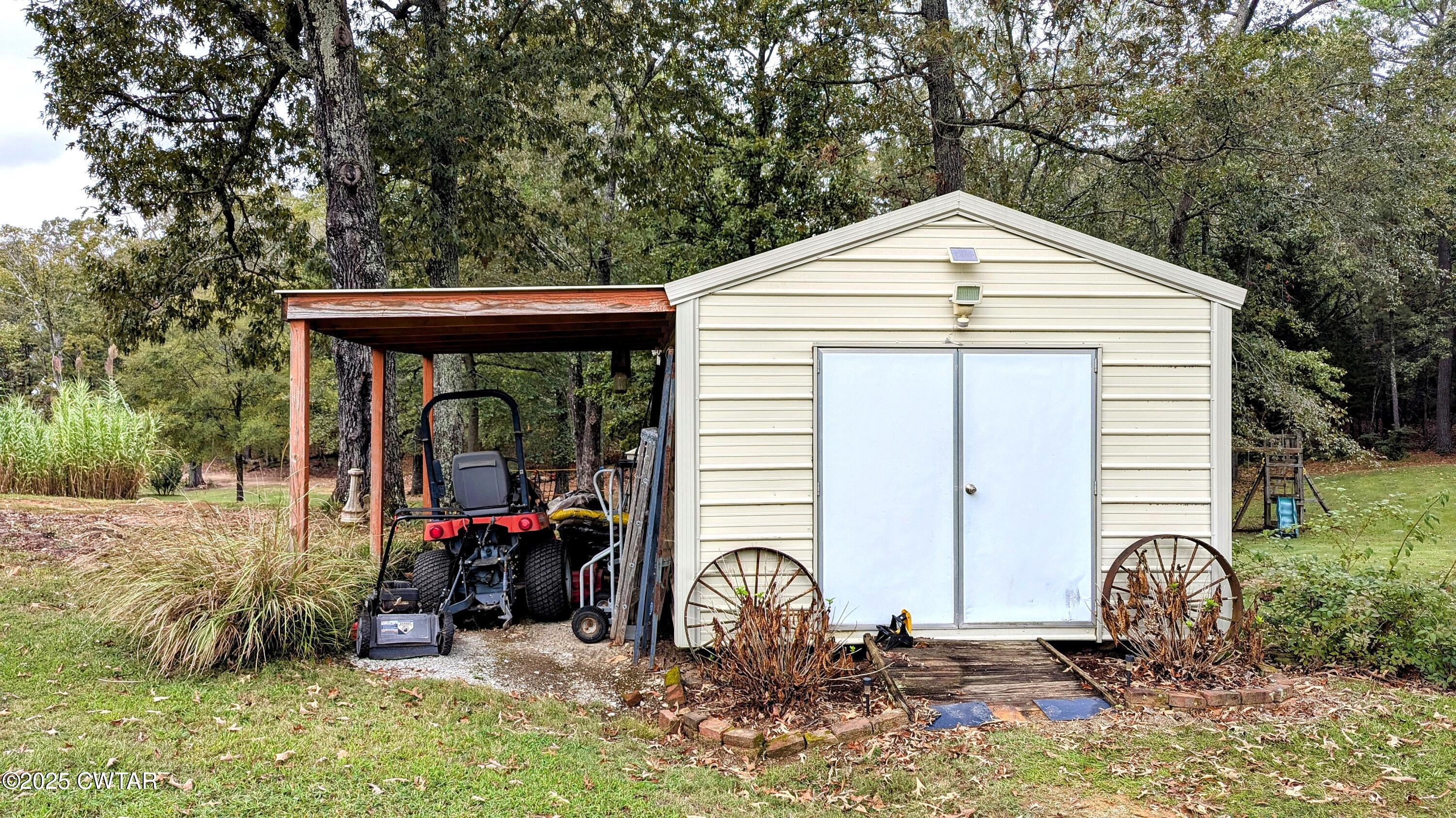614 Oneal Lane Henderson, TN 38340 - Photo 63 of 69 a front view of a house with garden