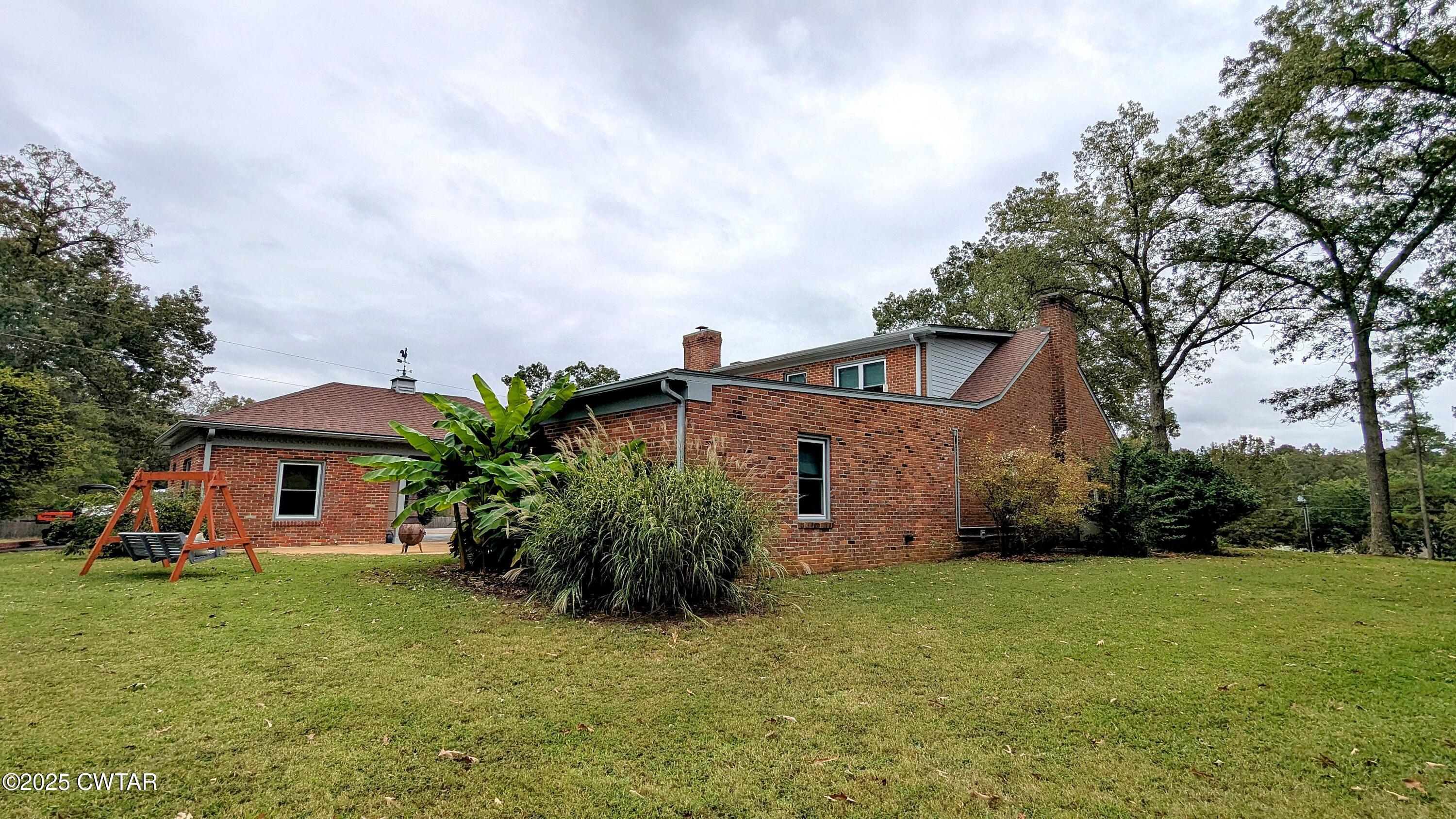 614 Oneal Lane Henderson, TN 38340 - Photo 64 of 69 a front view of a house with garden