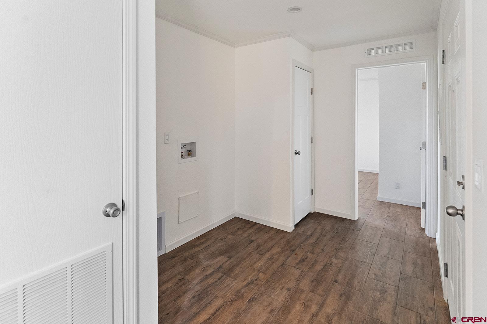 62650 Lasalle Road, Unit 341 Montrose, CO 81403 - Photo 14 of 22 a view of a hallway with wooden floor