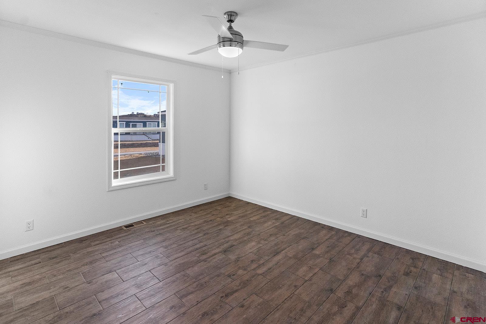 62650 Lasalle Road, Unit 341 Montrose, CO 81403 - Photo 15 of 22 wooden floor in an empty room with a window