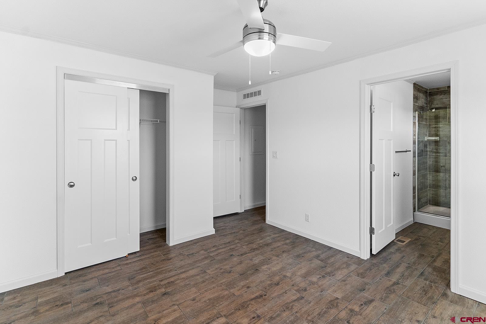 62650 Lasalle Road, Unit 341 Montrose, CO 81403 - Photo 16 of 22 wooden floor in an empty room with a bathroom