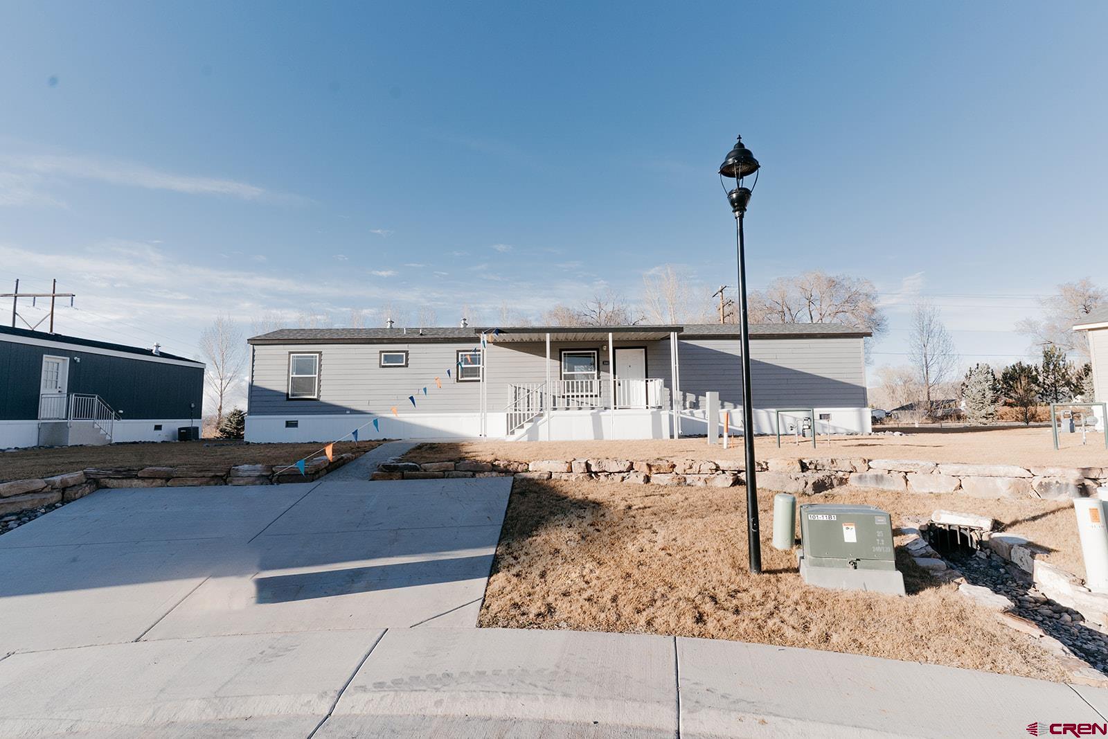 62650 Lasalle Road, Unit 341 Montrose, CO 81403 - Photo 2 of 22 a front view of a house with garden