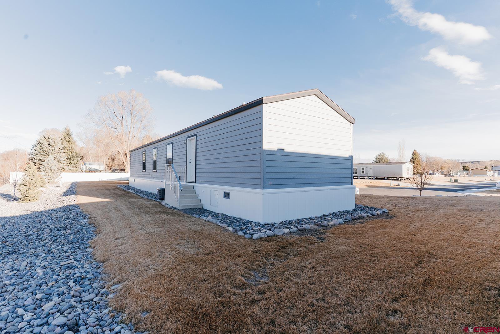 62650 Lasalle Road, Unit 341 Montrose, CO 81403 - Photo 4 of 22 a view of a back yard of the house