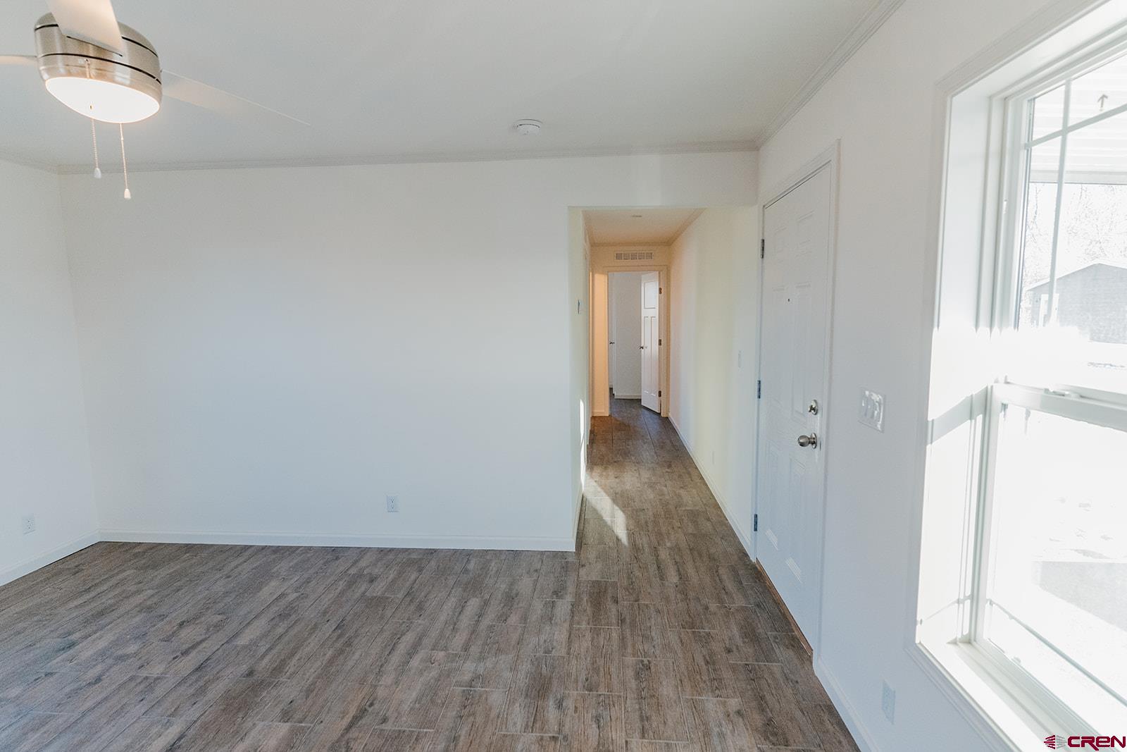 62650 Lasalle Road, Unit 341 Montrose, CO 81403 - Photo 10 of 22 a view of a hallway with wooden floor and a window