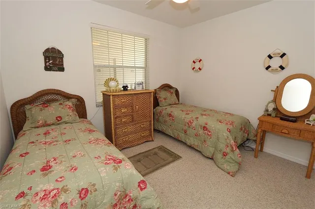 a bedroom with a bed and a dresser in it