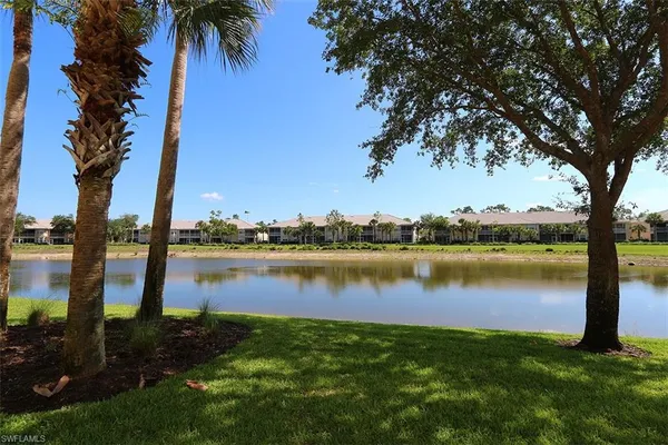 a view of a lake with a big yard