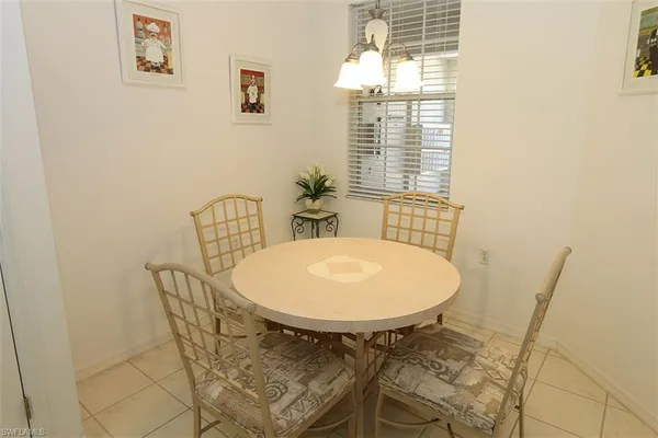 a view of a dining room with furniture and window