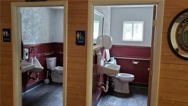 a view of living room with furniture and wooden floor