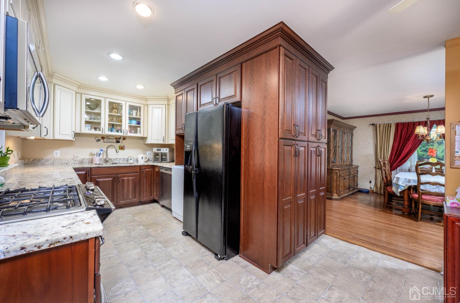 45 Stockton Road Kendall Park, NJ 08824 - Photo 11 of 30 a kitchen with stainless steel appliances granite countertop a refrigerator a stove and a sink