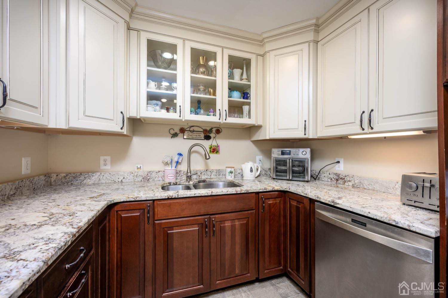 45 Stockton Road Kendall Park, NJ 08824 - Photo 12 of 30 a kitchen with granite countertop a sink stainless steel appliances and cabinets