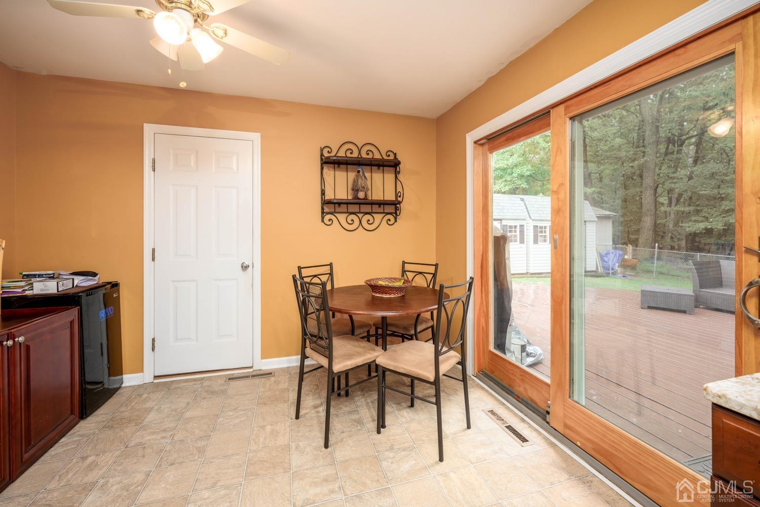 45 Stockton Road Kendall Park, NJ 08824 - Photo 16 of 30 a view of a dining room with furniture and a window