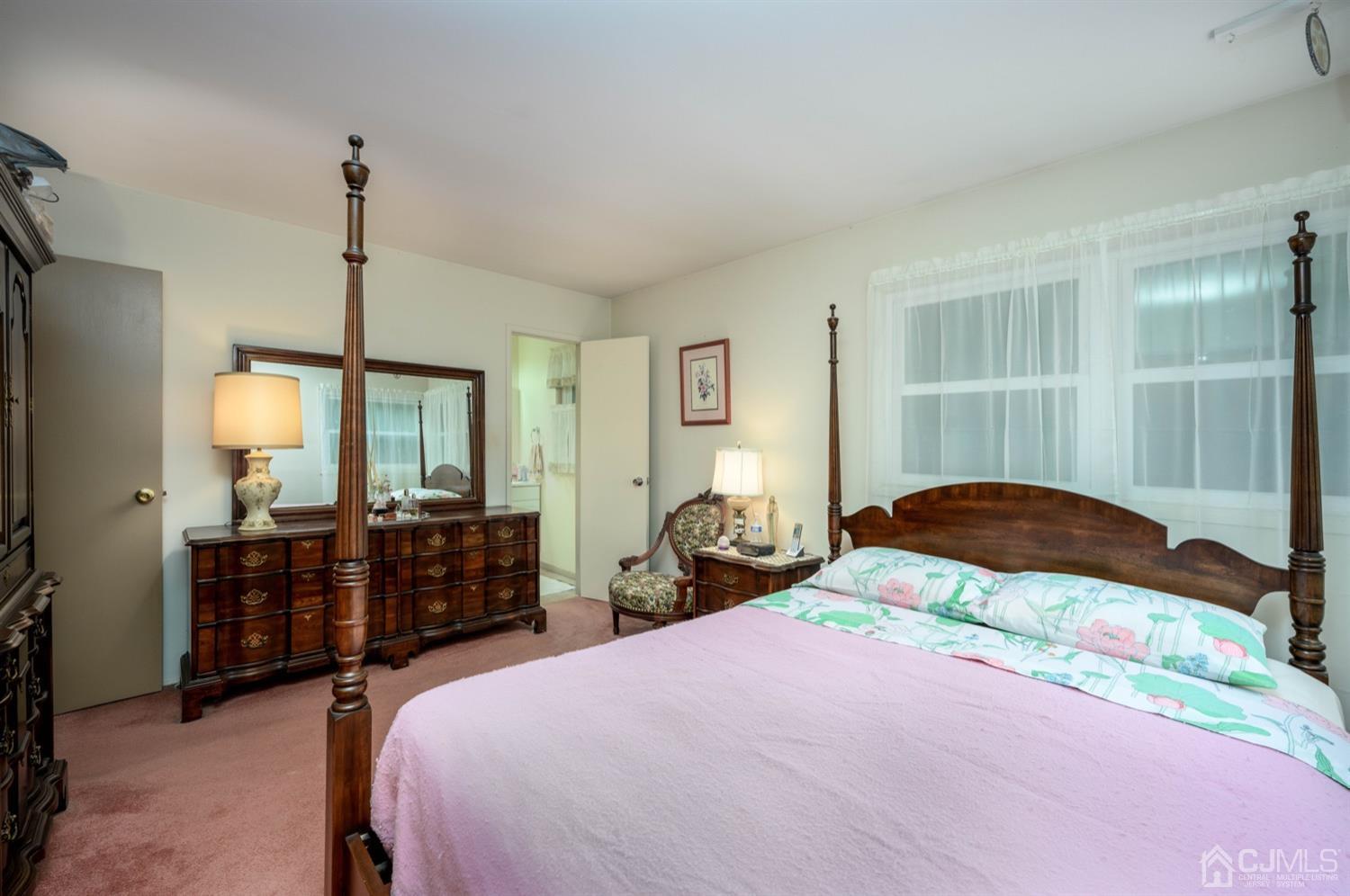 45 Stockton Road Kendall Park, NJ 08824 - Photo 19 of 30 a bedroom with a bed and wooden floor