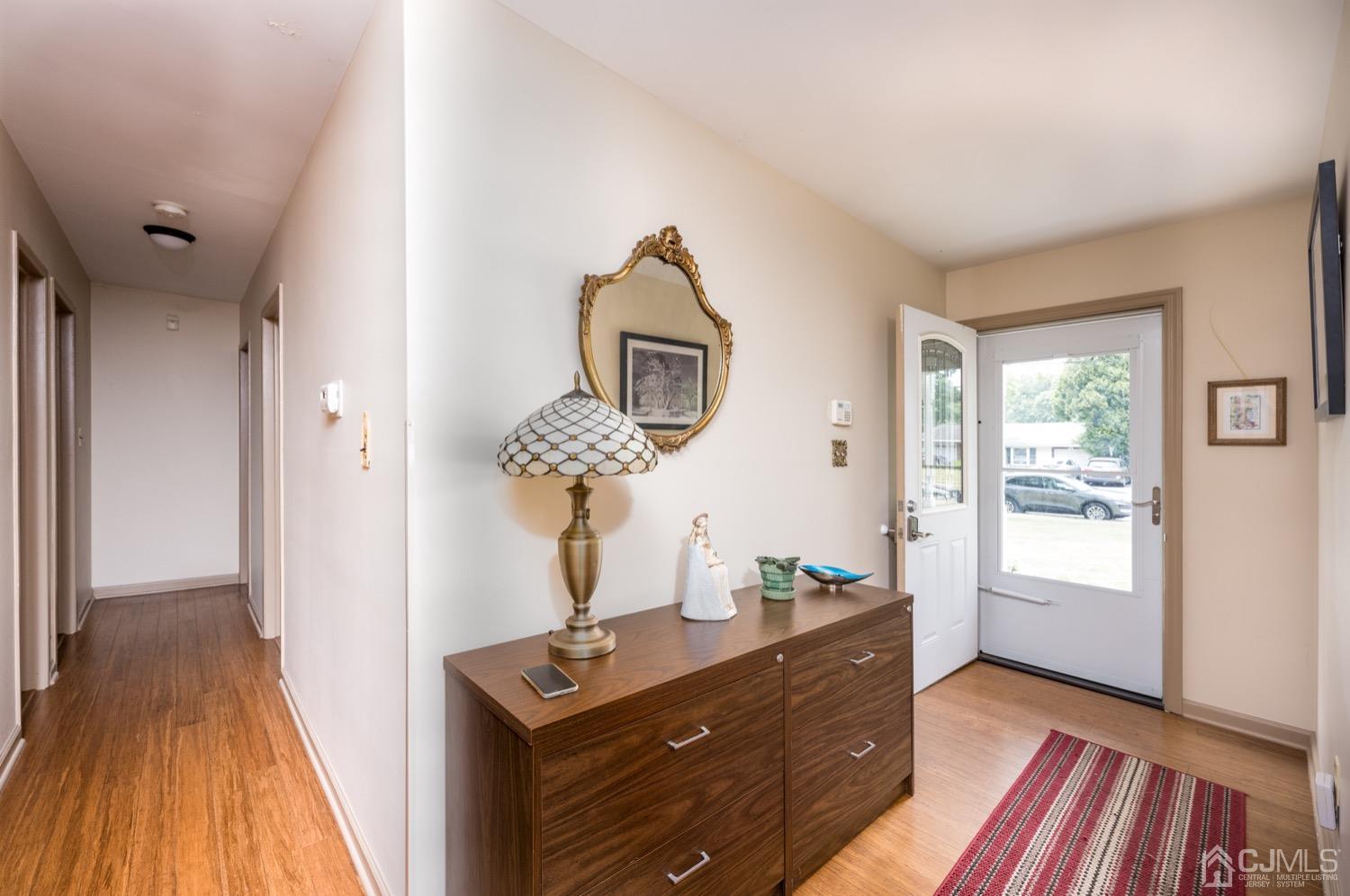 45 Stockton Road Kendall Park, NJ 08824 - Photo 4 of 30 a room with wooden floor and window