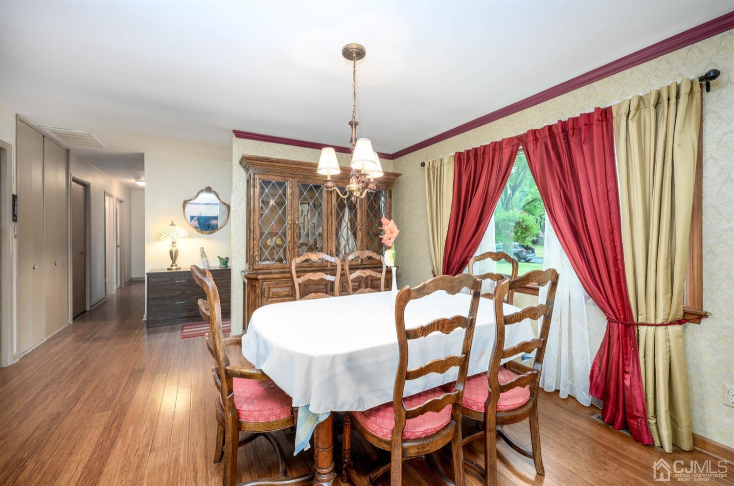45 Stockton Road Kendall Park, NJ 08824 - Photo 7 of 30 a view of a dining room with furniture window and wooden floor