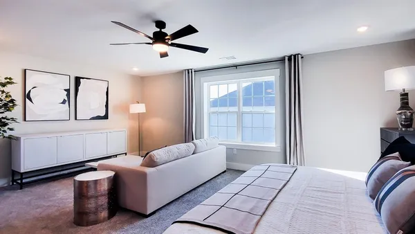 a bedroom with furniture and a window