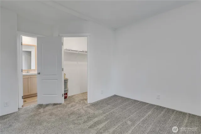 an empty room with closet area