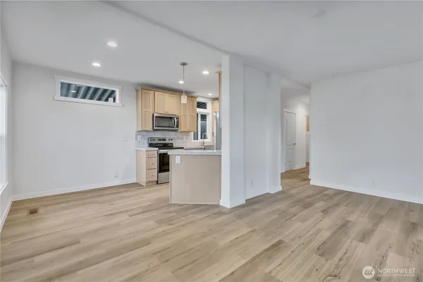 a view of kitchen with wooden floor