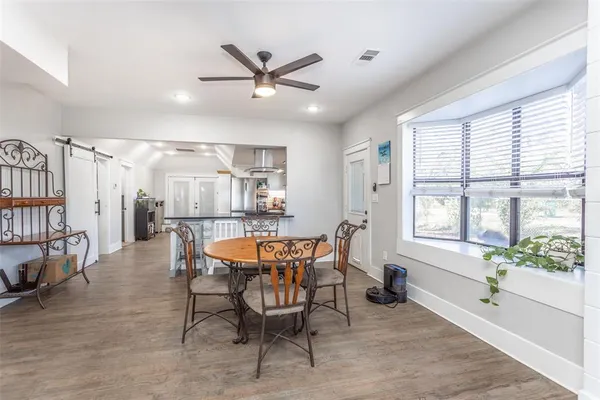 a dining room with furniture and window