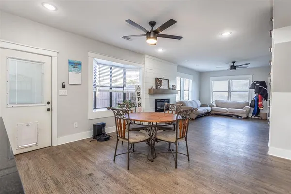 a work room with furniture and a wooden floor