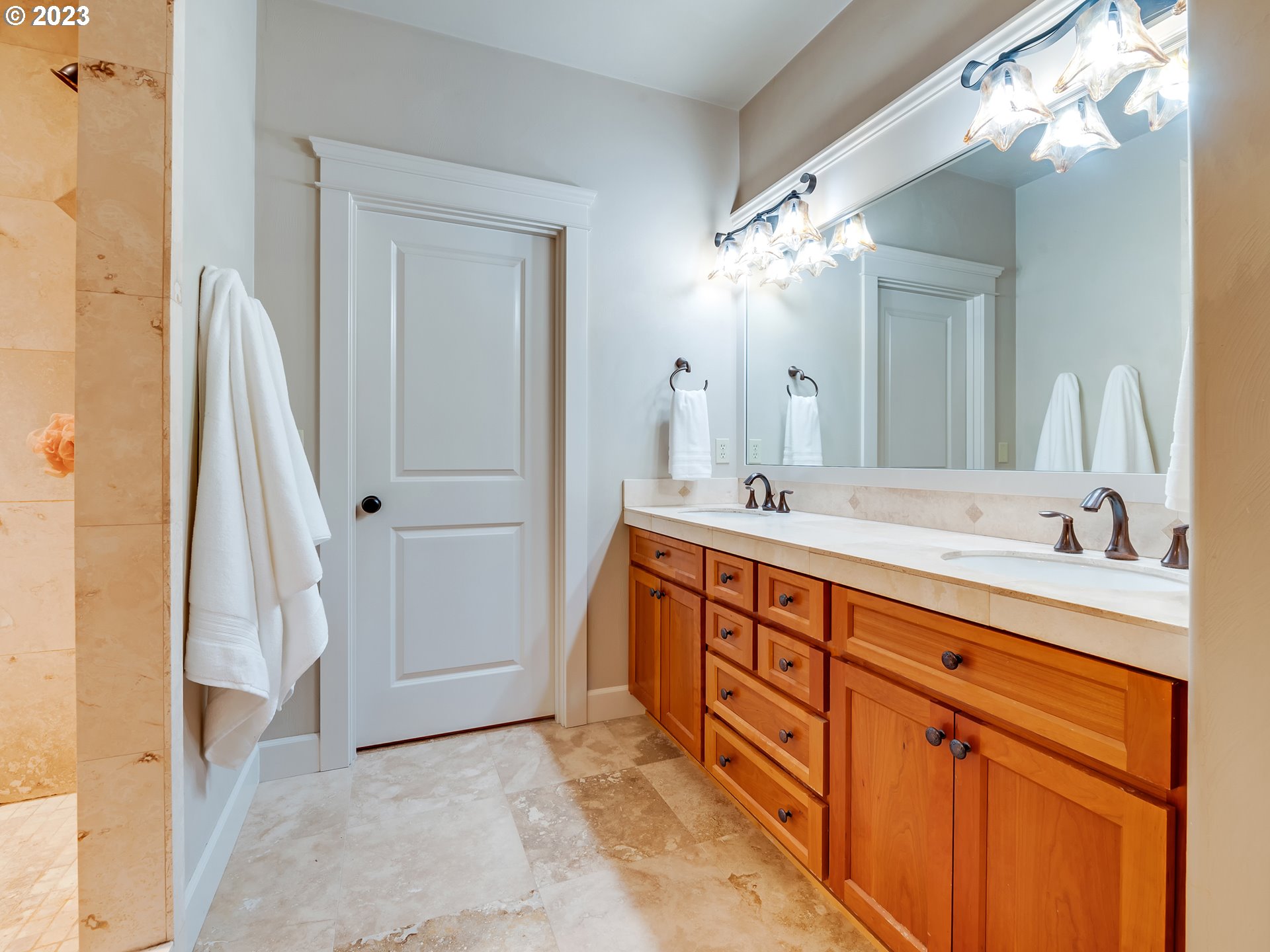 6251 Graystone Loop Springfield, OR 97478 - Photo 16 of 32 a spacious bathroom with a double vanity sink and a mirror