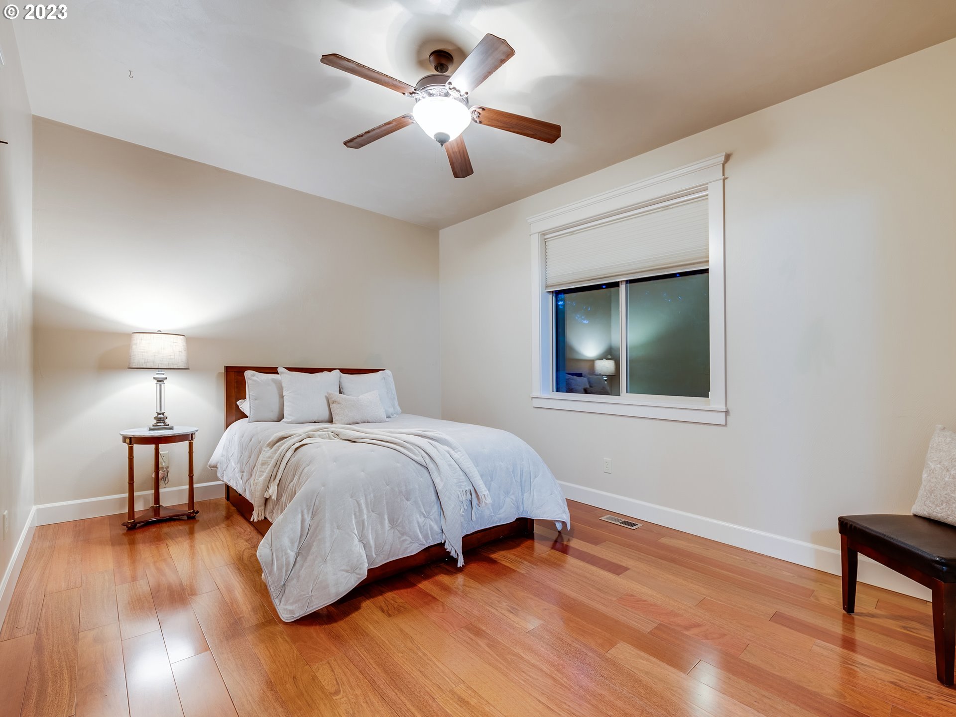 6251 Graystone Loop Springfield, OR 97478 - Photo 17 of 32 a bedroom with a large bed and a chandelier
