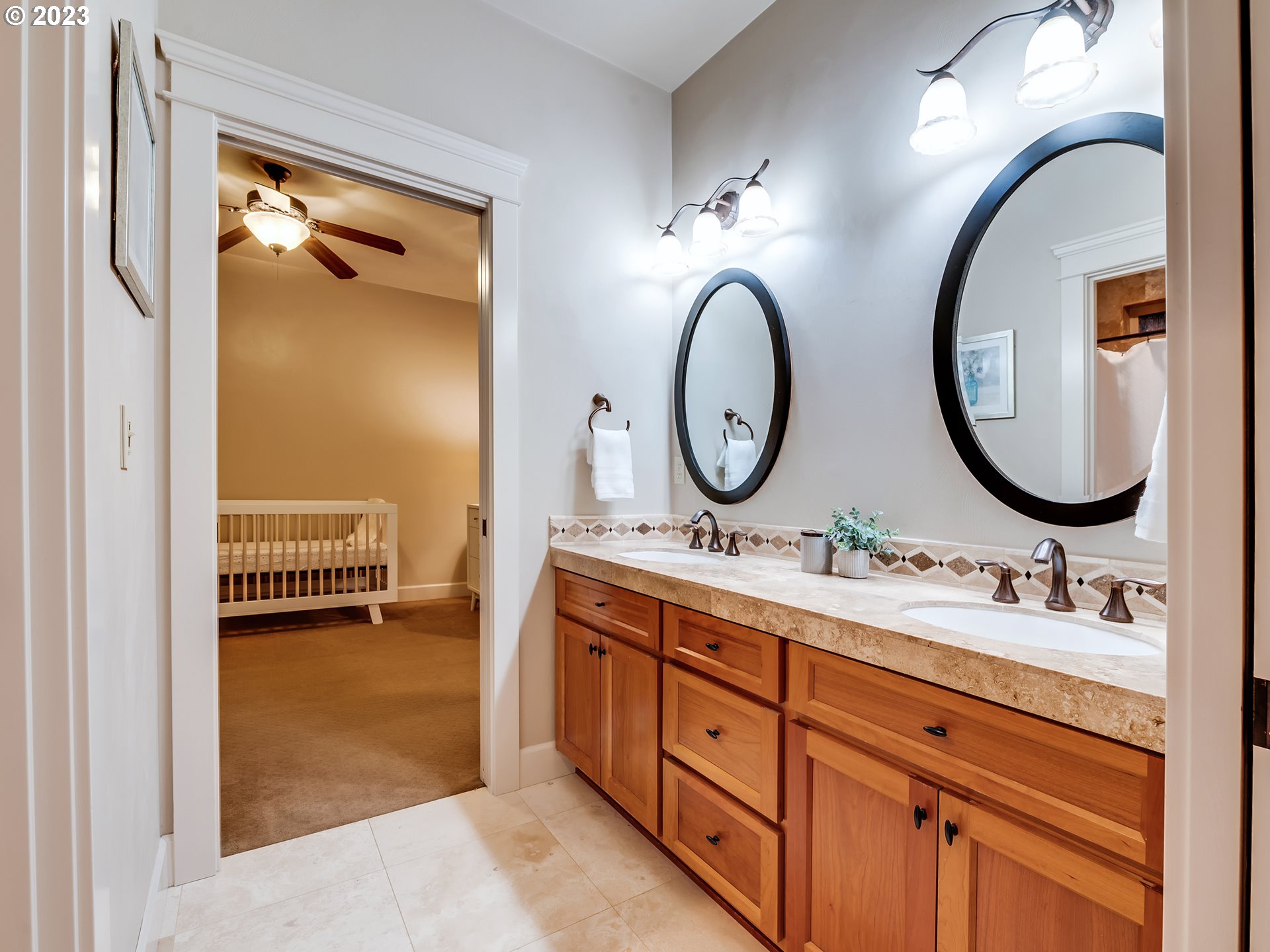 6251 Graystone Loop Springfield, OR 97478 - Photo 18 of 32 a en suite bathroom with a double vanity sink and a mirror