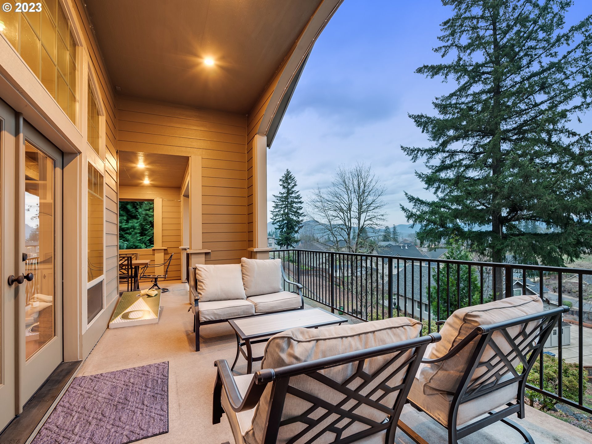 6251 Graystone Loop Springfield, OR 97478 - Photo 8 of 32 a view of a patio with a dining table and chairs with wooden floor