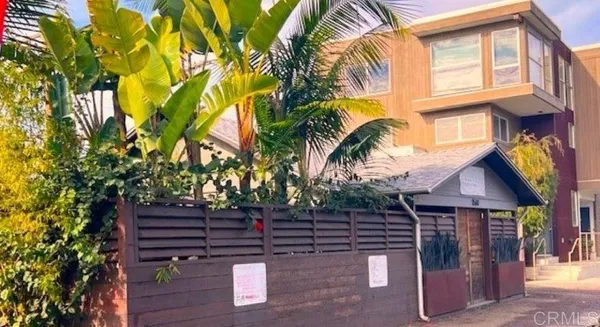 a view of a house with a tree