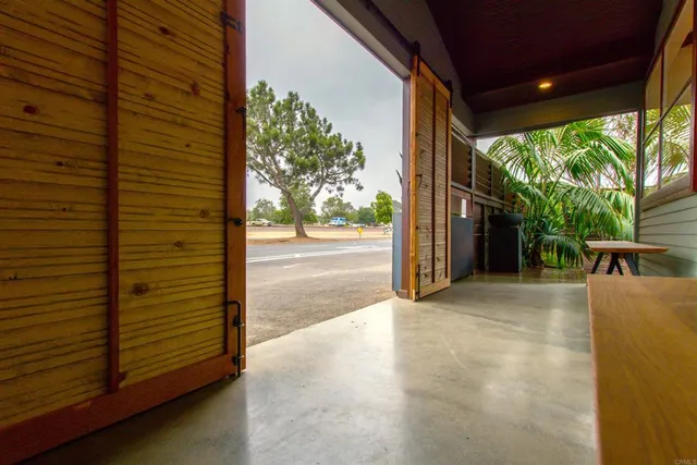 a view of a porch with wooden floor