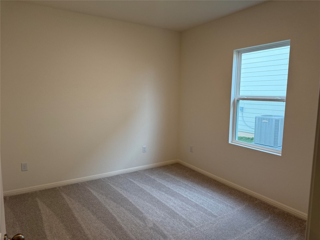 417 Wedemeyer Street Taylor, TX 76574 - Photo 11 of 15 an empty room with a window