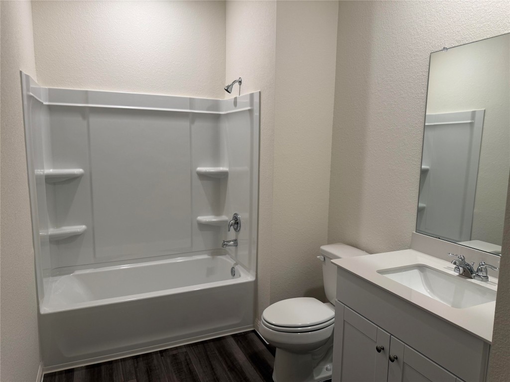 417 Wedemeyer Street Taylor, TX 76574 - Photo 12 of 15 a bathroom with a sink toilet and bathtub