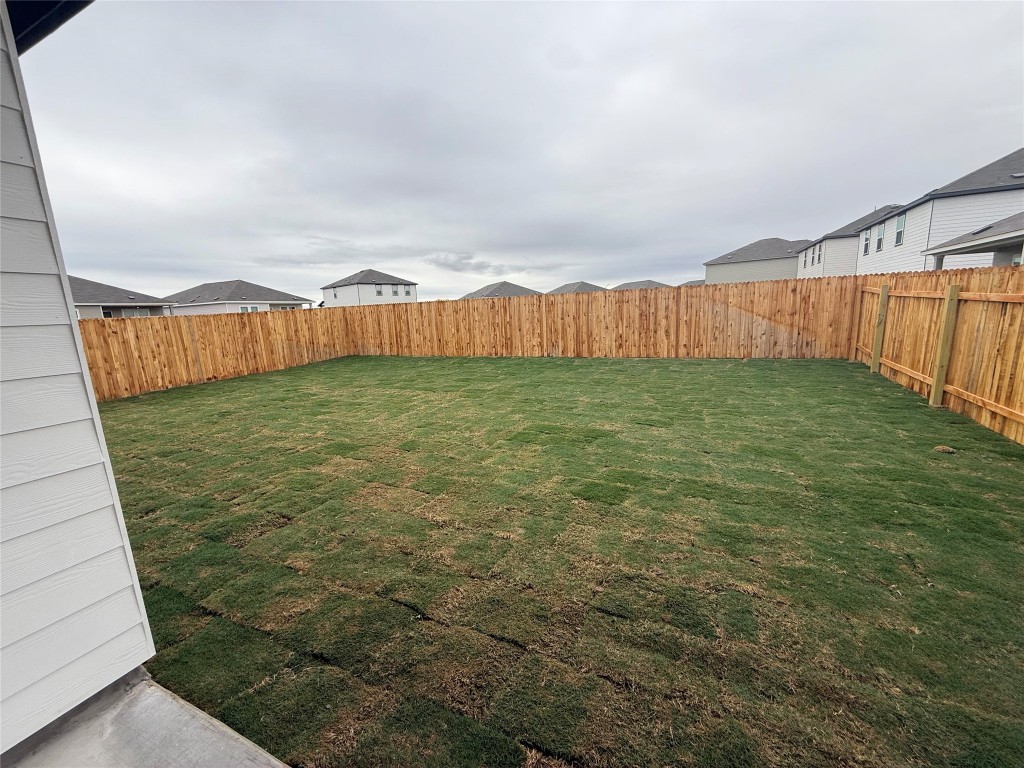 417 Wedemeyer Street Taylor, TX 76574 - Photo 14 of 15 a view of a pathway with an ocean in the background