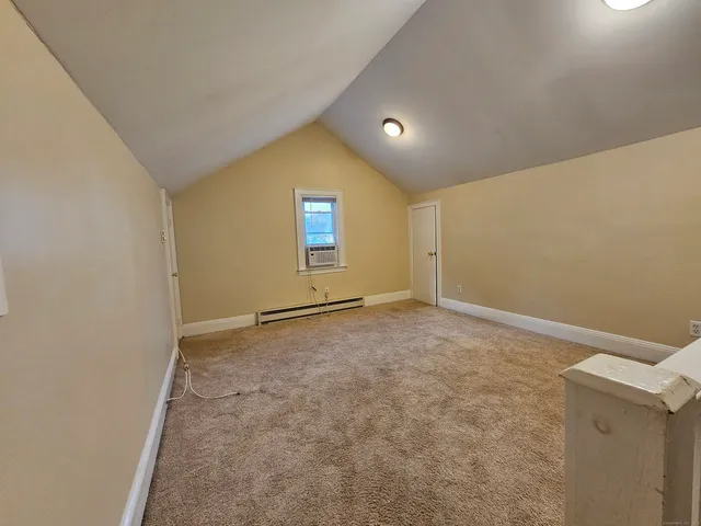 an empty room with a empty space and windows