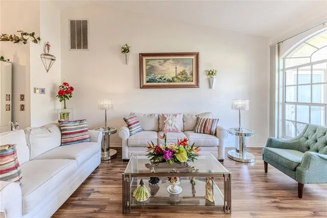 a view of a dining room with furniture large window and outside view